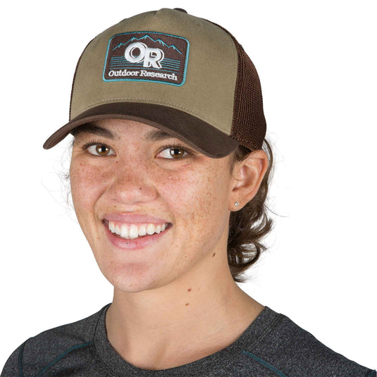 outdoor research advocate trucker cap cafe on head front