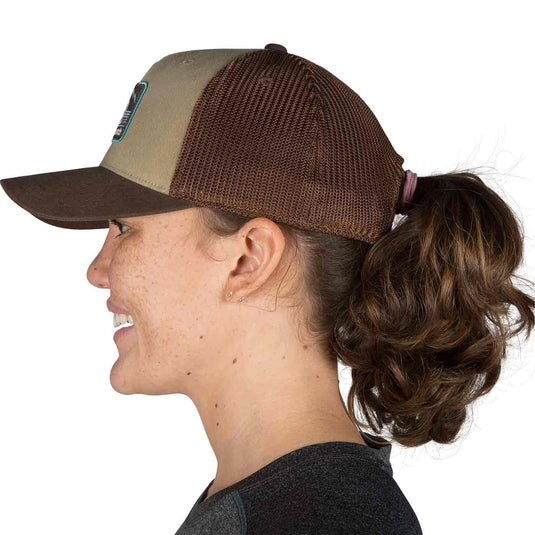 outdoor research advocate trucker cap cafe on head side