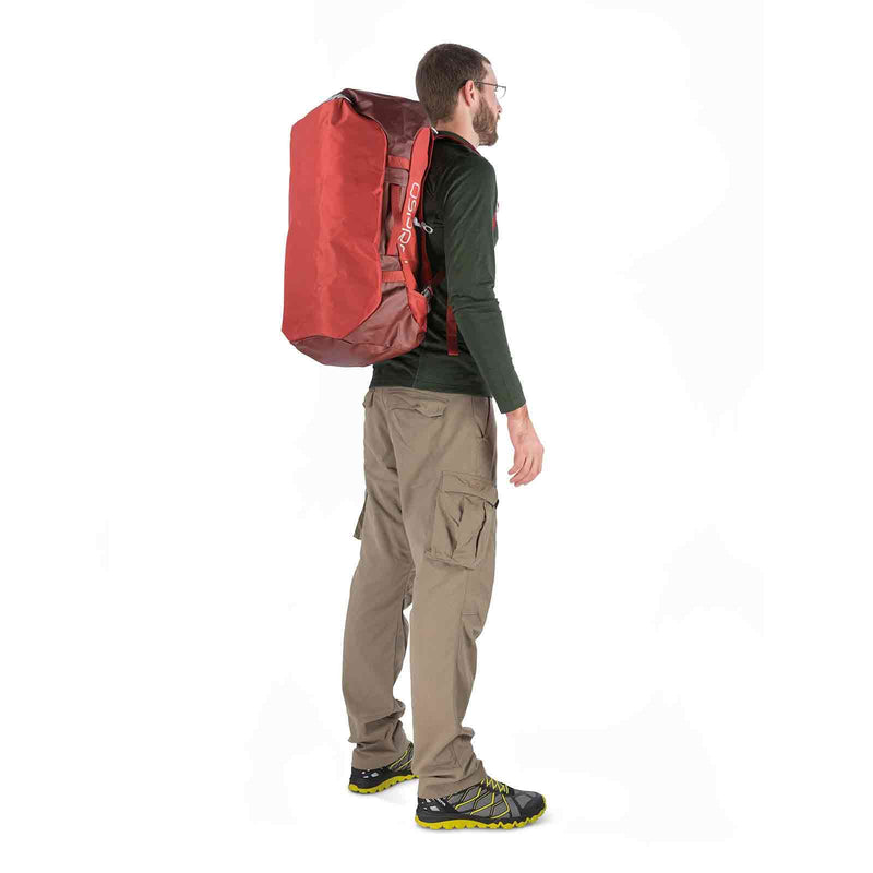 Load image into Gallery viewer, osprey transporter 65 duffel bag on body 2 ruffian red
